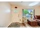 Bright living room with laminate flooring, a vintage door and a large window at 517 7Th St, Boulder City, NV 89005