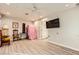 Neutral living space with wood-look floors, ceiling fan, and minimal decor at 517 7Th St, Boulder City, NV 89005