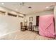 Cozy living room featuring wood-look floors, ceiling fan, and natural light at 517 7Th St, Boulder City, NV 89005