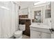 Clean bathroom showcasing vanity storage, a shower with curtain, and neutral tones at 5181 Morris St, Las Vegas, NV 89122