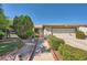 Charming single-story home with well-manicured landscaping, covered entry, and attached garage at 5181 Morris St, Las Vegas, NV 89122