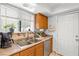 Kitchen area featuring a stainless steel sink and a view of the exterior through the window at 5181 Morris St, Las Vegas, NV 89122