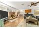 Warm living room with a brick fireplace, and open view into dining area at 5181 Morris St, Las Vegas, NV 89122