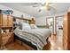 Cozy main bedroom featuring wood cabinets, a queen-sized bed, and an ensuite bathroom at 5181 Morris St, Las Vegas, NV 89122
