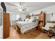 Comfortable main bedroom features hardwood floors, built-in storage, and a rocking chair at 5181 Morris St, Las Vegas, NV 89122