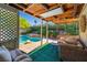 Inviting covered patio area overlooking a sparkling swimming pool and lush backyard at 5181 Morris St, Las Vegas, NV 89122