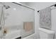 Bathroom with shower-tub combo, white tile, and modern fixtures at 5221 Tropical Peach Dr, Las Vegas, NV 89118