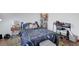 Bedroom with dark wood floors, a window view, and fun décor at 5221 Tropical Peach Dr, Las Vegas, NV 89118