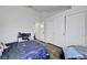 Bedroom featuring an office area, dark wood floors, and double closets at 5221 Tropical Peach Dr, Las Vegas, NV 89118