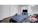 Cozy bedroom with closet space, window shutters, TV, beanbag chair, and a bed with playful bedding at 5221 Tropical Peach Dr, Las Vegas, NV 89118