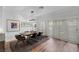 Elegant dining room with a modern chandelier and large windows at 5221 Tropical Peach Dr, Las Vegas, NV 89118