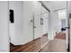 Hallway featuring hardwood floors, mirrored closet and access to multiple rooms at 5221 Tropical Peach Dr, Las Vegas, NV 89118