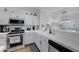 Bright kitchen with stainless steel appliances and white countertops at 5221 Tropical Peach Dr, Las Vegas, NV 89118