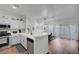 Bright kitchen with white cabinets and stainless steel appliances at 5221 Tropical Peach Dr, Las Vegas, NV 89118