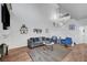 Bright living room with fireplace, modern decor, and staircase at 5221 Tropical Peach Dr, Las Vegas, NV 89118
