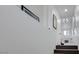 Hallway with carpeted staircase, white walls, and framed artwork at 5221 Tropical Peach Dr, Las Vegas, NV 89118