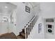 Carpeted staircase with white railing and white trim, leading to the second floor at 5221 Tropical Peach Dr, Las Vegas, NV 89118