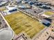Community showcasing a clubhouse, pool, bocce ball court, and playground, with vast green spaces and desert scenery at 5436 Succulent Rose Dr, Las Vegas, NV 89135