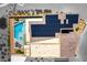 Aerial view of backyard, with a pool, patio seating, and solar panels on the roof at 5436 Succulent Rose Dr, Las Vegas, NV 89135