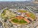 Expansive aerial view of a community park with baseball fields and lush green spaces in a Gathering-friendly neighborhood at 5436 Succulent Rose Dr, Las Vegas, NV 89135