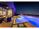 Attractive pool area with modern seating and lighting in the backyard of this inviting home at 5436 Succulent Rose Dr, Las Vegas, NV 89135