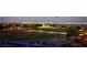 A beautiful sports field provides a delightful night view of the city skyline in the distance at 5436 Succulent Rose Dr, Las Vegas, NV 89135