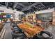 Clubhouse interior featuring modern furnishings, a large table with chairs, and stylish decor at 5436 Succulent Rose Dr, Las Vegas, NV 89135