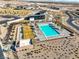 Community pool and clubhouse, surrounded by desert landscaping, offering a refreshing and social community space at 5436 Succulent Rose Dr, Las Vegas, NV 89135