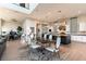 Open-concept living space with dining area, modern kitchen, and a chic table that seats six at 5436 Succulent Rose Dr, Las Vegas, NV 89135