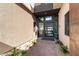 Stylish entryway with a modern glass door and desert landscaping at 5436 Succulent Rose Dr, Las Vegas, NV 89135