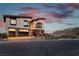 Modern residence featuring a two-car garage and tasteful landscaping, offering an upscale living experience at 5436 Succulent Rose Dr, Las Vegas, NV 89135