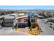Contemporary two-story home showcasing modern architectural design, complemented by desert landscaping and a paved driveway at 5436 Succulent Rose Dr, Las Vegas, NV 89135