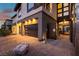 Modern two-story home with a three-car garage and well-lit exterior, showcasing contemporary design elements at 5436 Succulent Rose Dr, Las Vegas, NV 89135