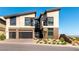 Modern two-story home with a two-car garage, desert landscaping, and mountain views at 5436 Succulent Rose Dr, Las Vegas, NV 89135