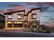 Modern two-story home with a two-car garage, and desert landscaping at 5436 Succulent Rose Dr, Las Vegas, NV 89135