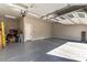 Clean and organized three-car garage with epoxy floors, offering plenty of space for vehicles and storage at 5436 Succulent Rose Dr, Las Vegas, NV 89135