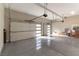 Spacious 3-car garage with epoxy flooring and modern doors, providing ample parking and storage space at 5436 Succulent Rose Dr, Las Vegas, NV 89135