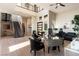 Bright, open home office with a modern desk and staircase, complemented by ample natural light at 5436 Succulent Rose Dr, Las Vegas, NV 89135