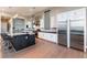 Well-equipped kitchen featuring a large island, stainless steel appliances, and sleek white cabinetry at 5436 Succulent Rose Dr, Las Vegas, NV 89135