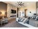 Well-lit main bedroom features decorative stone wall, fireplace, and large windows at 5436 Succulent Rose Dr, Las Vegas, NV 89135