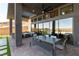 Covered patio boasts ample seating, ceiling fan, and access to the pool at 5436 Succulent Rose Dr, Las Vegas, NV 89135