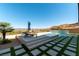 Backyard pool and lounge area with desert landscaping and city views at 5436 Succulent Rose Dr, Las Vegas, NV 89135