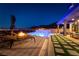 Outdoor living at its finest with a sleek pool, spa, fire pit, and lounge area overlooking the city at 5436 Succulent Rose Dr, Las Vegas, NV 89135