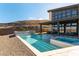Backyard pool and patio area with mountain views and lush landscaping at 5436 Succulent Rose Dr, Las Vegas, NV 89135