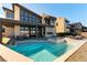 Backyard featuring a modern pool, hot tub, patio, and mountain views at 5436 Succulent Rose Dr, Las Vegas, NV 89135