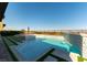 Backyard pool with a waterfall feature and mountain views in background at 5436 Succulent Rose Dr, Las Vegas, NV 89135