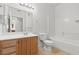 Bathroom features wood vanity with sink and a toilet and tub shower at 5655 E Sahara Ave # 2044, Las Vegas, NV 89142