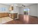 Bright kitchen with wood cabinetry, stainless steel appliances, and a breakfast bar, open to the living area at 5655 E Sahara Ave # 2044, Las Vegas, NV 89142