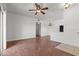 Bright living room with hardwood floors, ceiling fan, and ample space, creating an inviting atmosphere at 5655 E Sahara Ave # 2044, Las Vegas, NV 89142