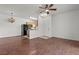 Open-concept living space with hardwood floors seamlessly connecting the living room and kitchen area at 5655 E Sahara Ave # 2044, Las Vegas, NV 89142